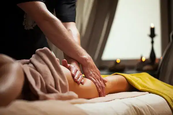 Deep tissue massage therapy for relaxation and pain relief at SpaMood. Professional masseuse providing soothing massage services in a serene spa environment.